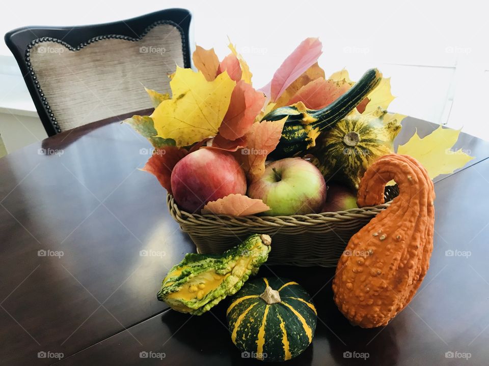 Happy fall! A composition with bright colorful autumn leaves, pumpkins and apples