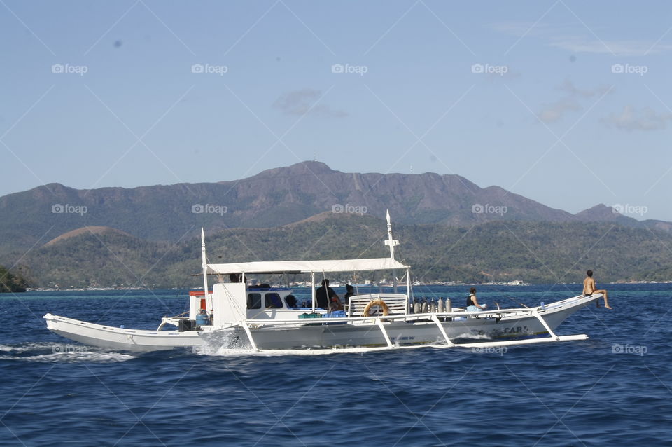 Lady enjoying the boatride seated at the front end of the boat