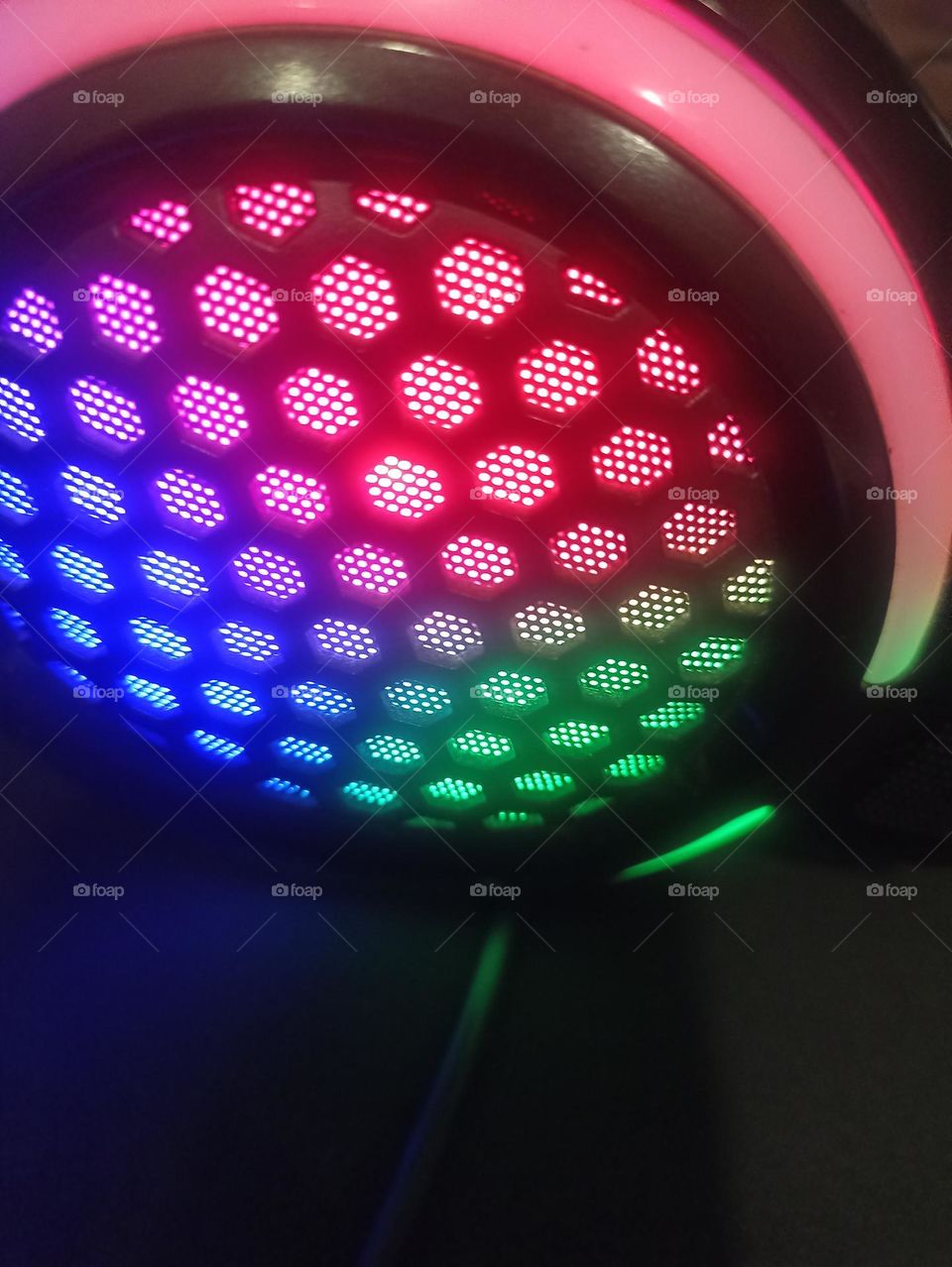 beauty of light on my ear phones on my table