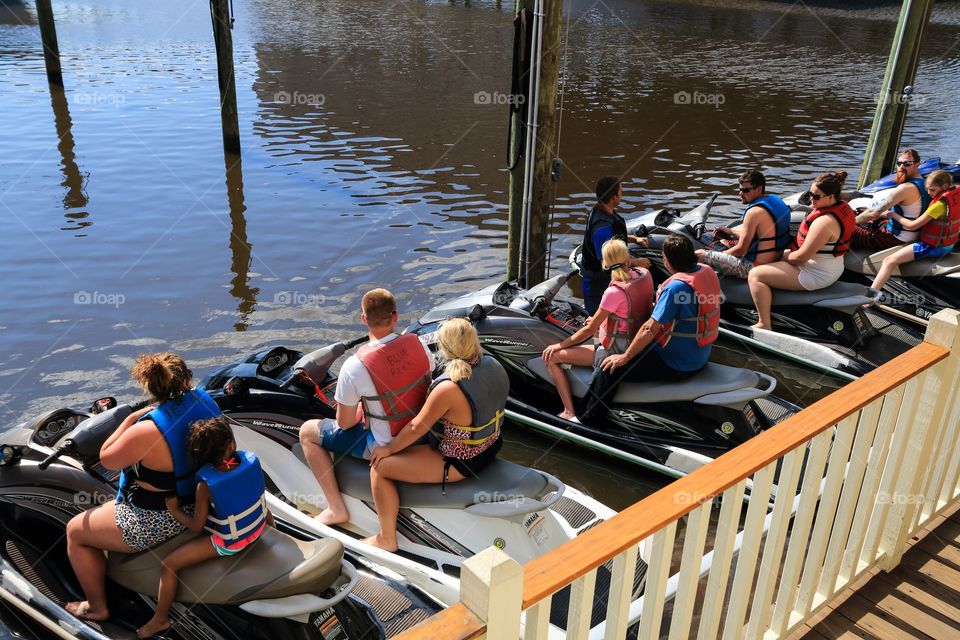 Tourist in the jet ski listening to the instruction