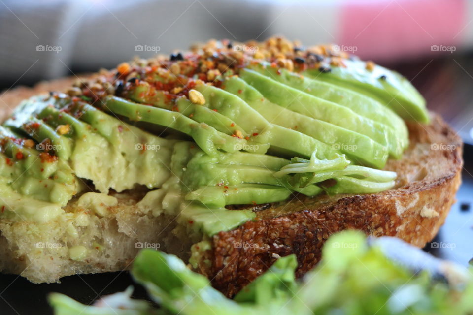 Avocado toast with honey , delicious- I already took a bite