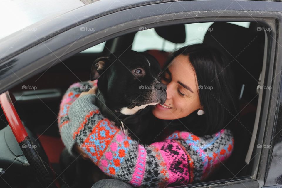 Woman with dog in car 