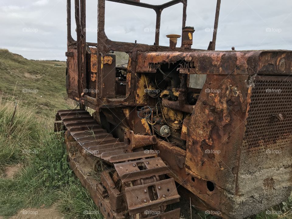 Rusty industrial seaside tractor 