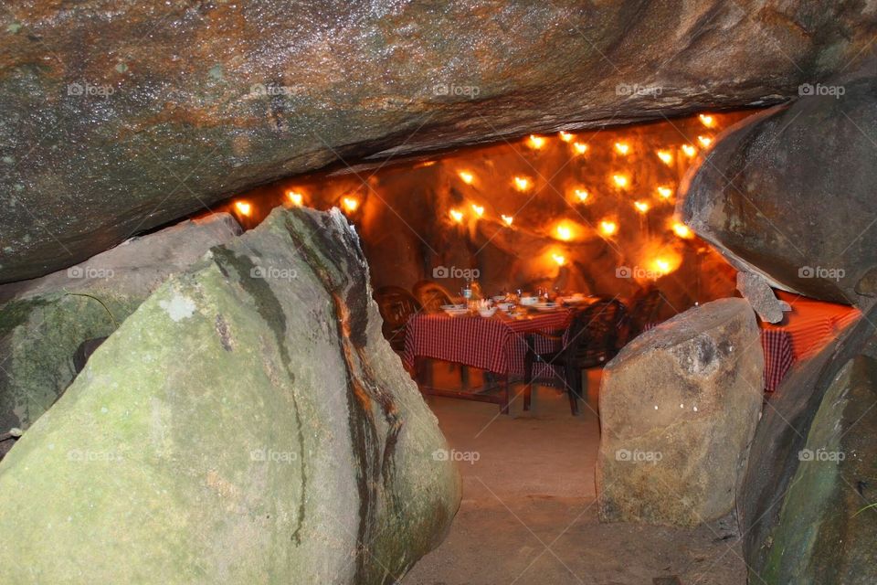 Romantic candle light dinner in a cave