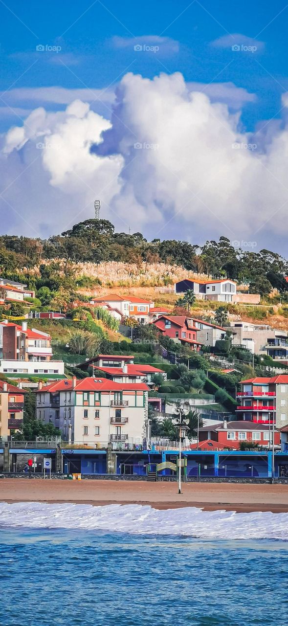 houses on a hill by the sea