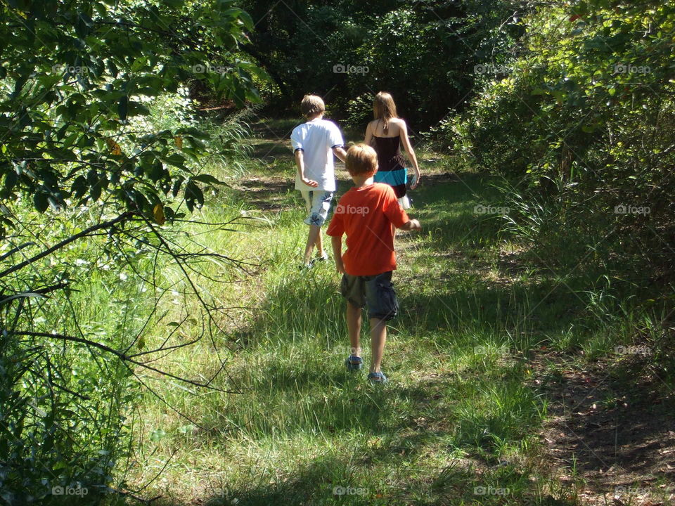 children walking through the woods