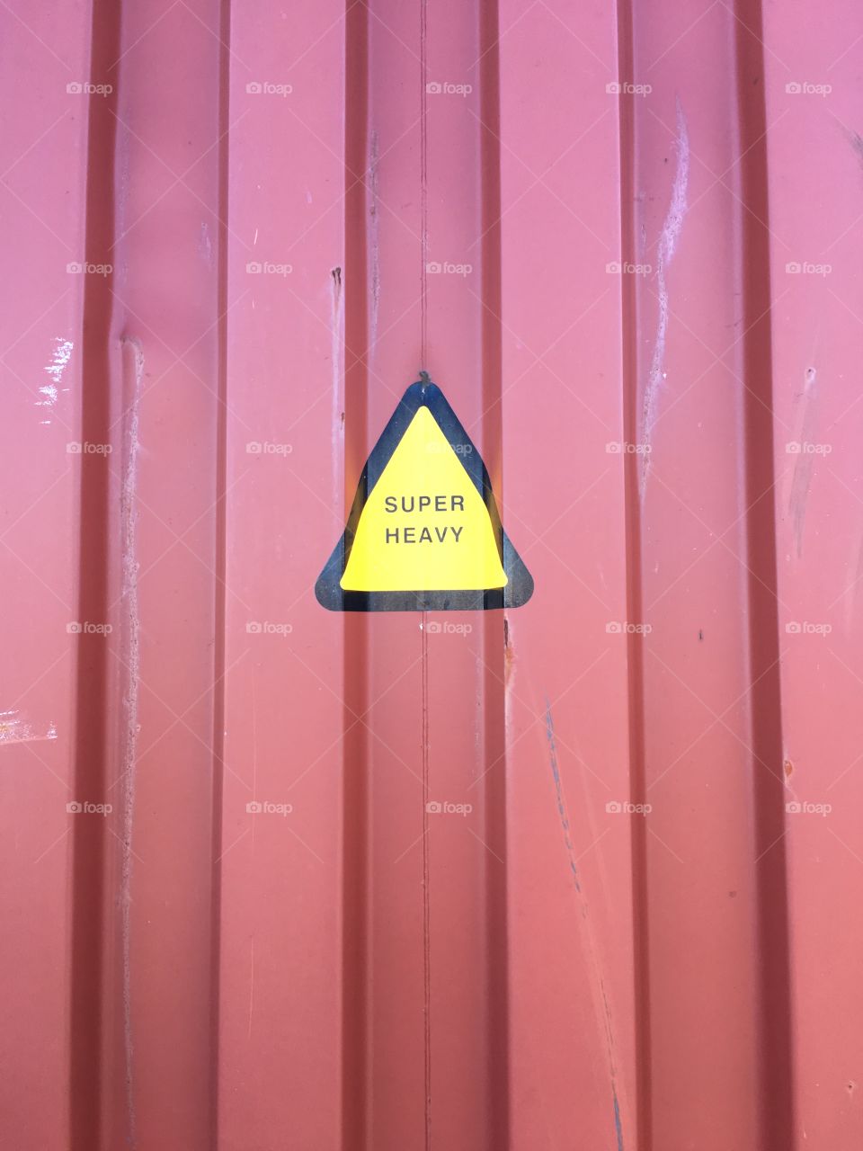 Super heavy sign on cargo container