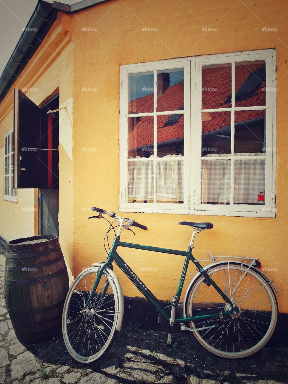A charming house and its stylish window. 
Photo taken in Bornholm