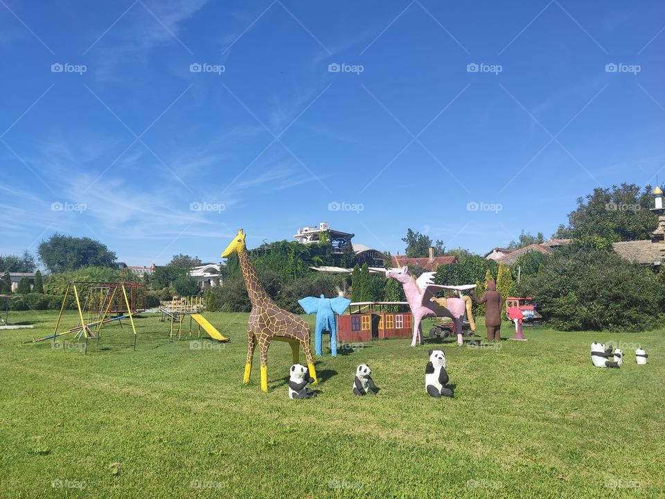 Children playground giraffe and pandas