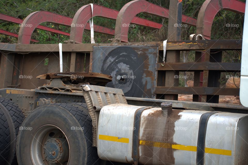 Road Accident: The Trailer Capsized Spilling A Load Of Timber Of Timber On The Side Of The Road