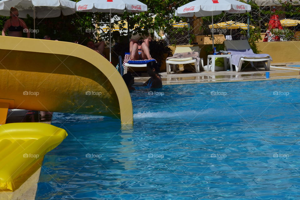 waterslide in pool.