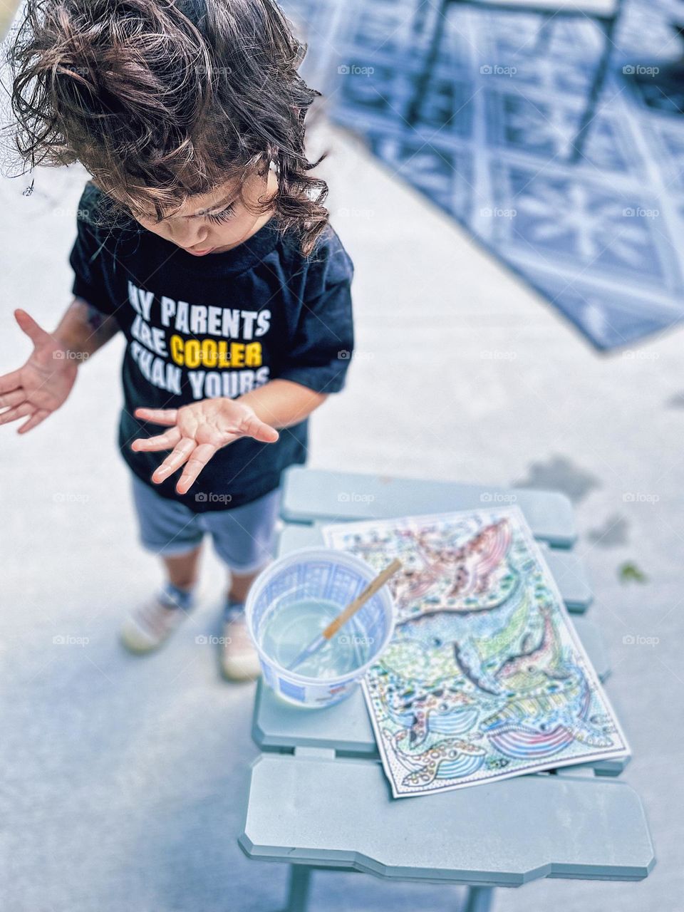 Toddler painting whales, Toddler girl painting outside, crafts outside in the summertime, toddler girl gets messy