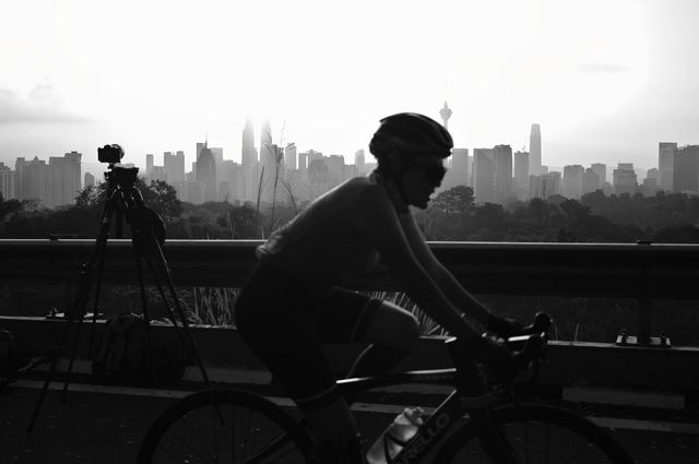 Cyclist over Kuala Lumpur city view
