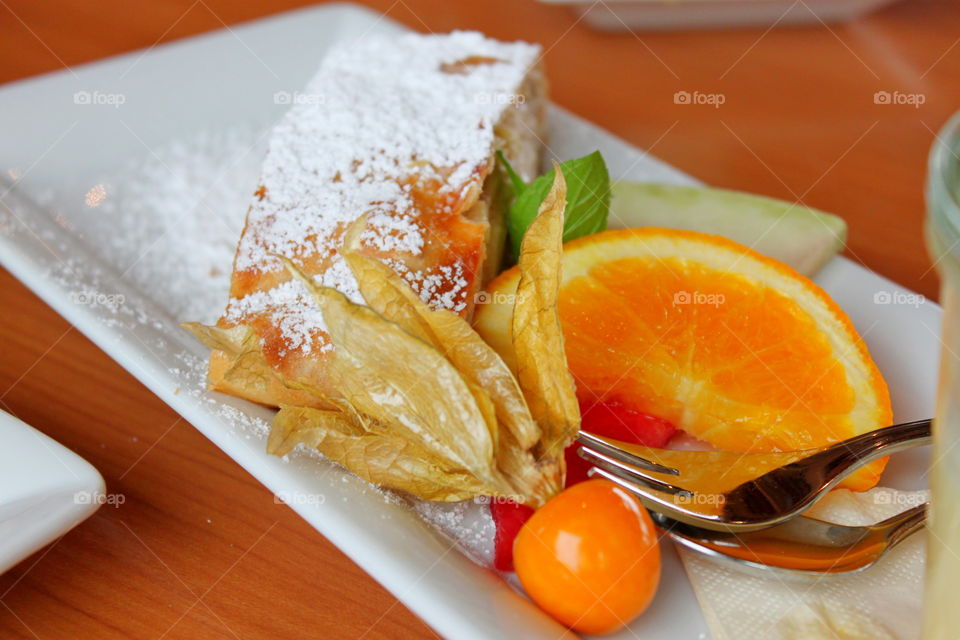 Food on a plate. dessert - strudel with fruit