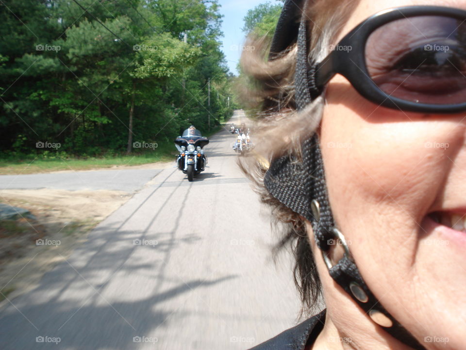 Selfie riding with other bikers on a motorcycle ride.