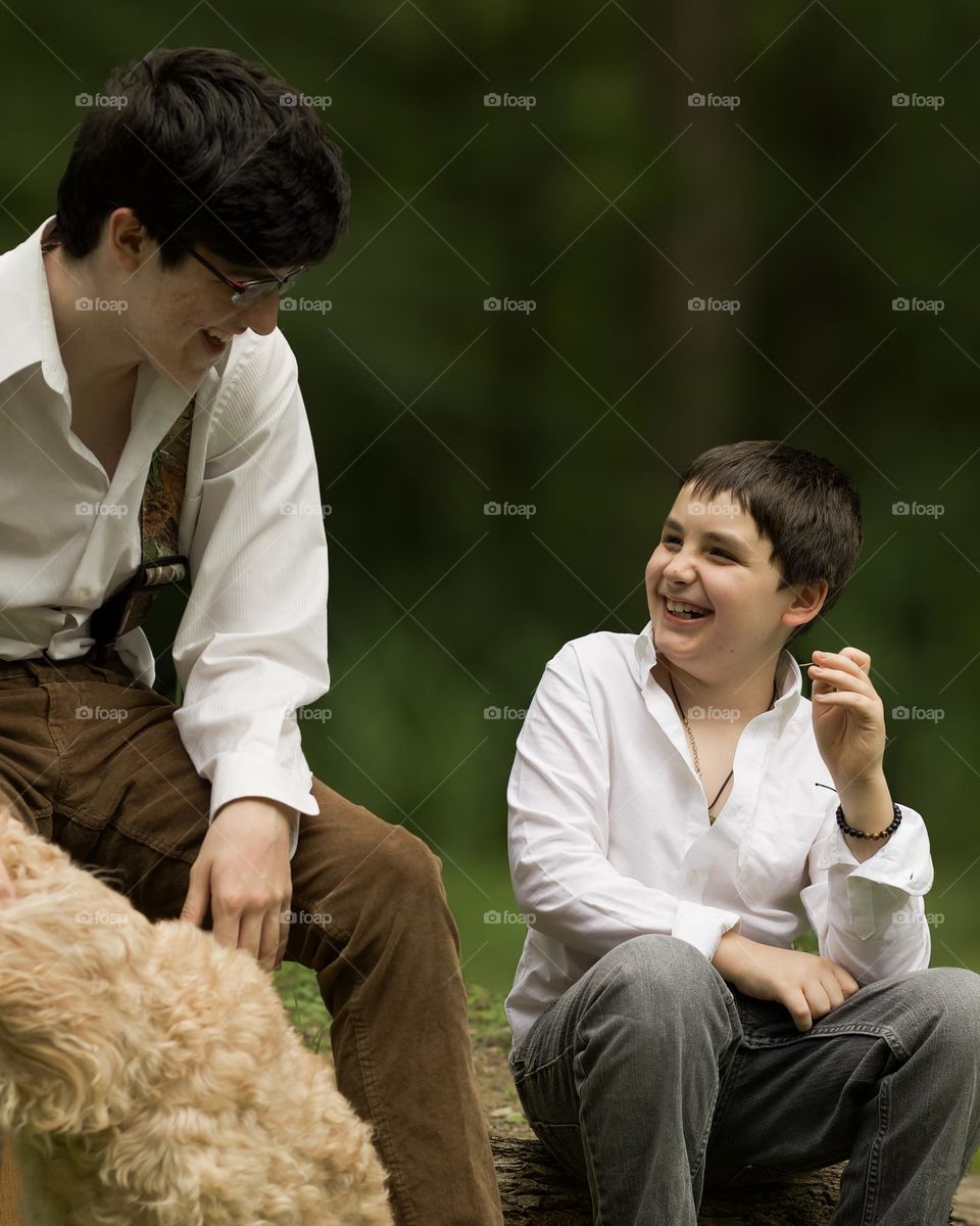 Boys Laughing together in vintage clothing