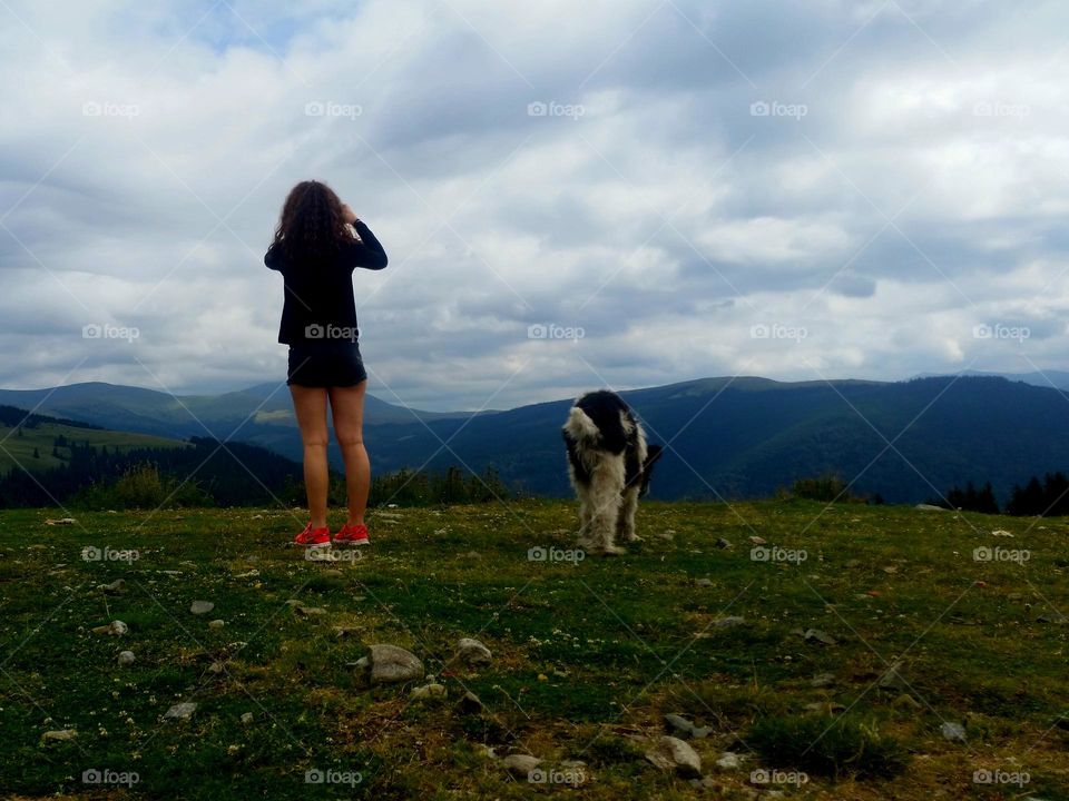 the girl and the dog above the world