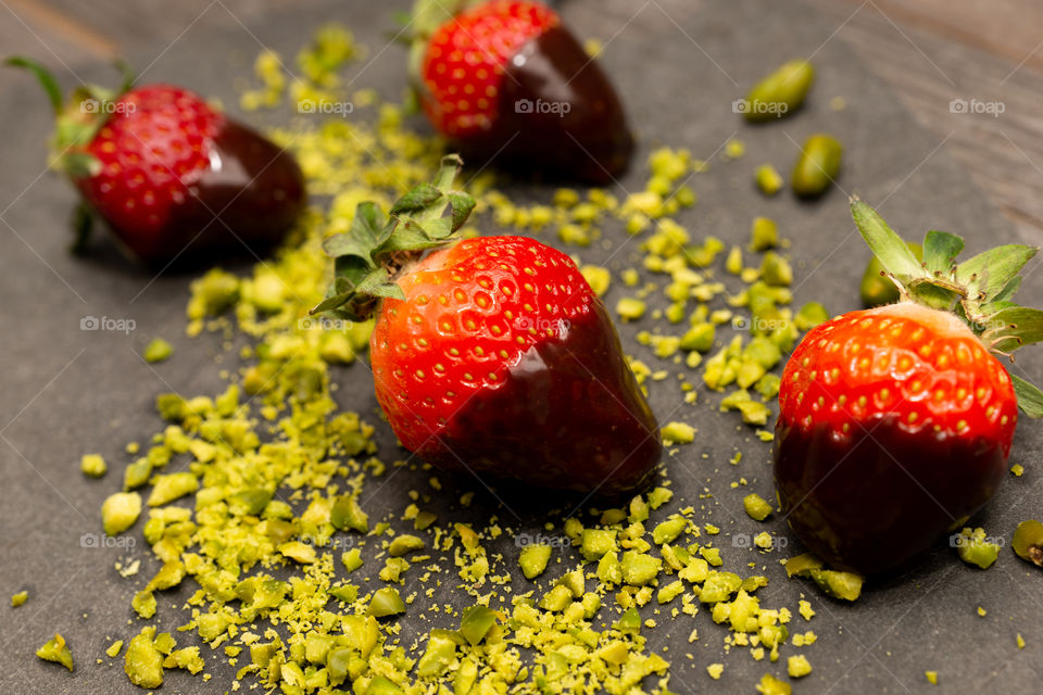 strawberries with chocolate and pistachio