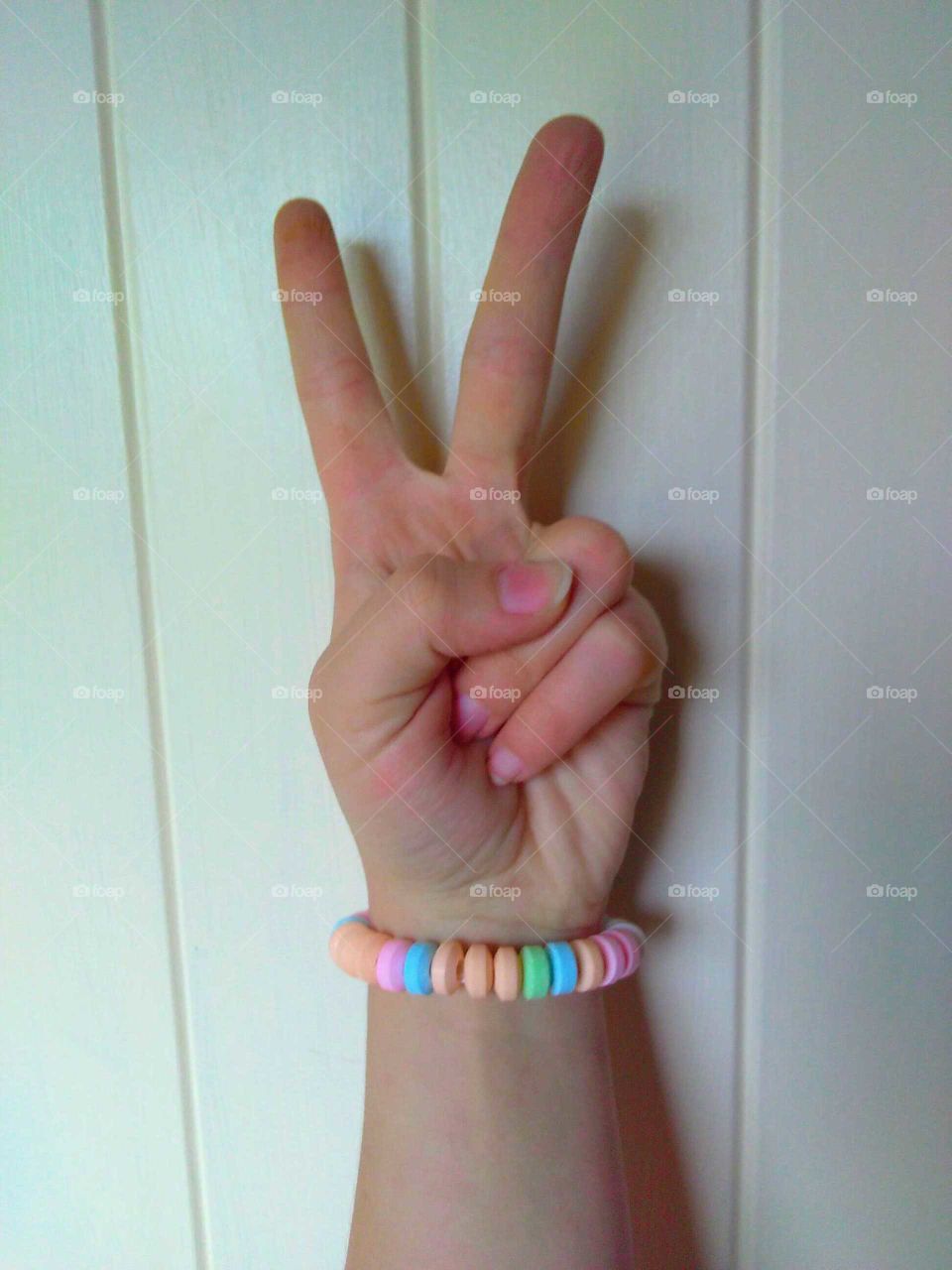 peace sign with a candy bracelet