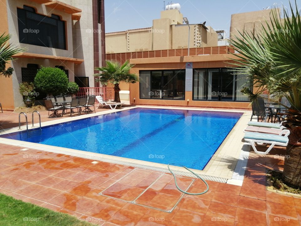 A swimming pool in a small compound in Riyadh
