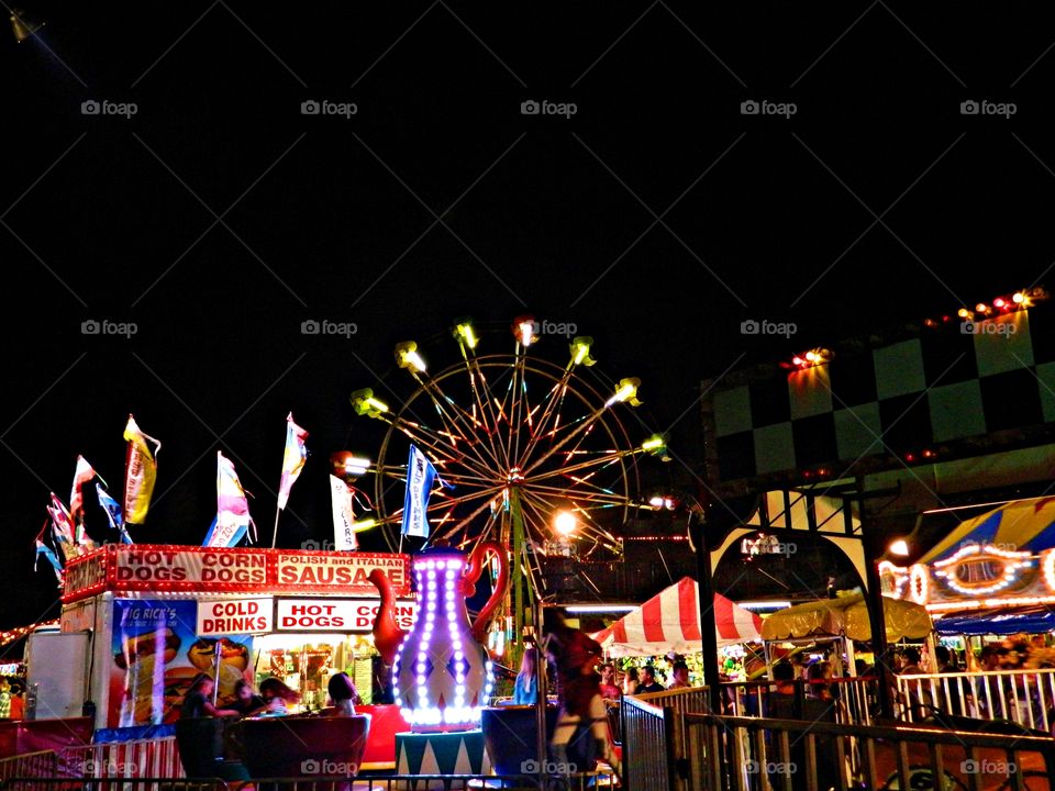 Day and night Foap Missions - Brilliantly lighted County fairgrounds where families gather to have fun