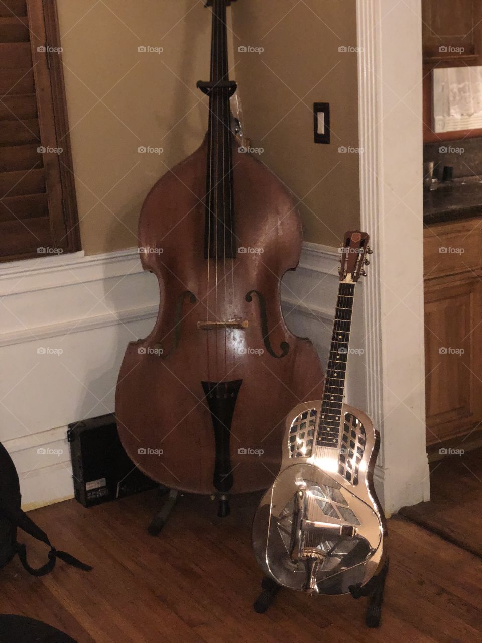 An upright double bass and tricone national guitar