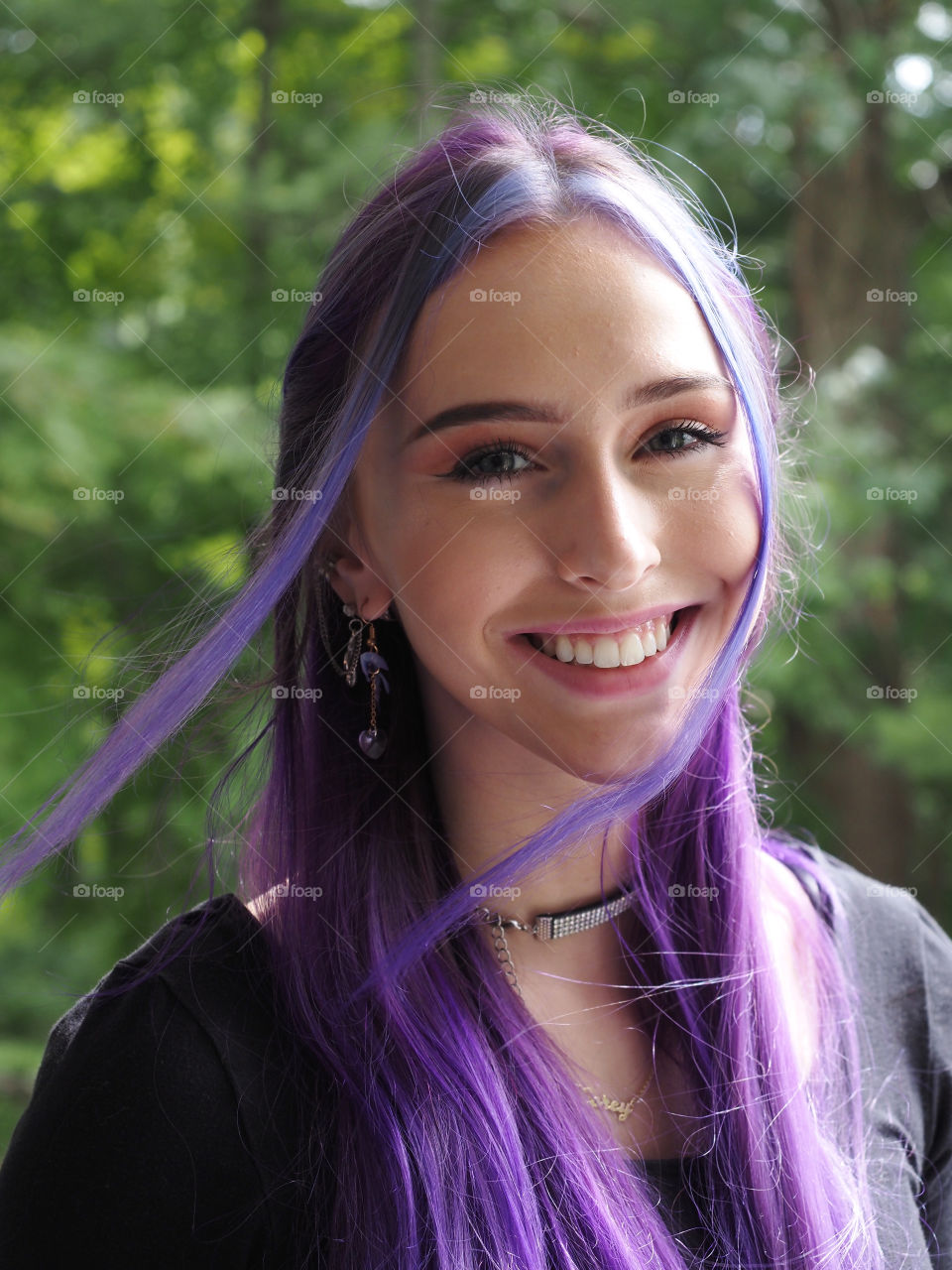 Natural light portrait, pretty young woman with purple hair. Made with Olympus OMD EM5 Mark3, M. Zuiko Pro lens 12-40mm f/2.8 