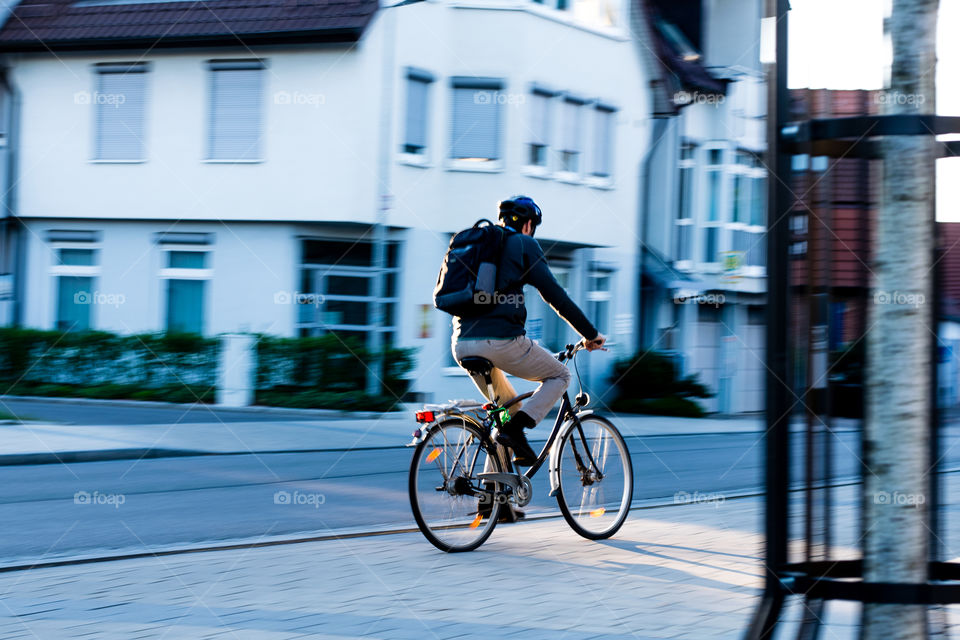 motorcyclist in motion on street