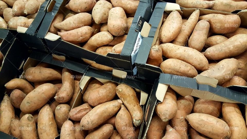 Sweet potatoes in black boxes