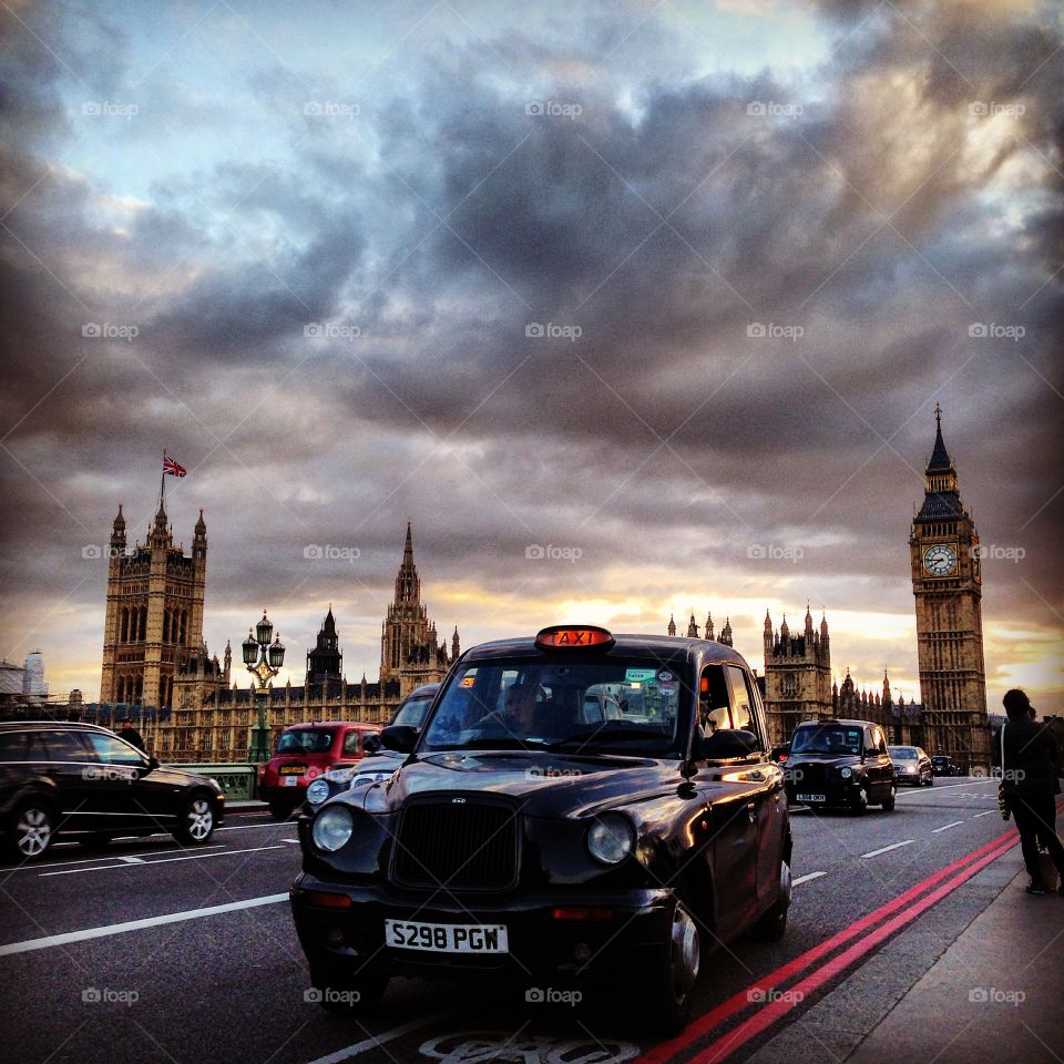 London Icons. Featuring a classic London taxi with British Parliament in the background. 