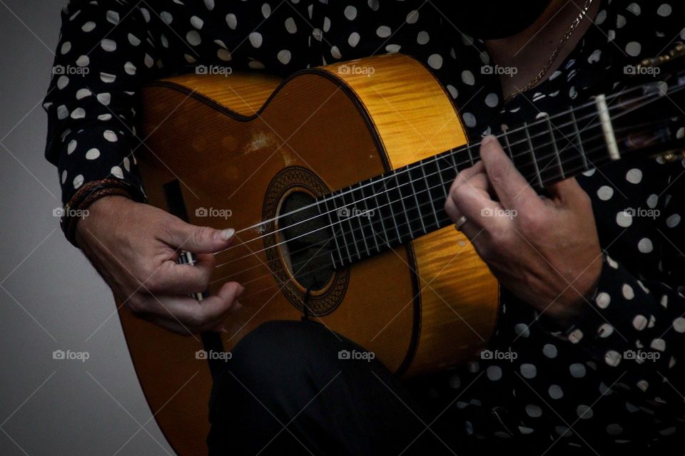 Man is playing guitar