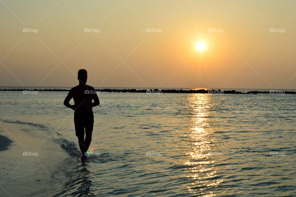 running at sunset on the beach