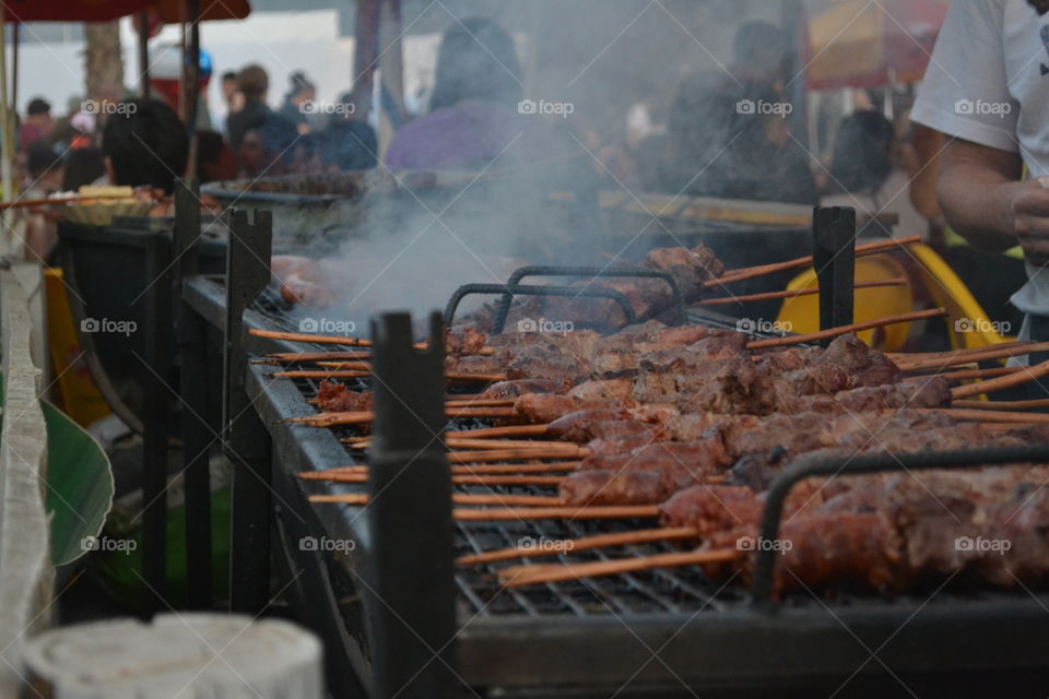 Skewers on barbecue grill at food stall