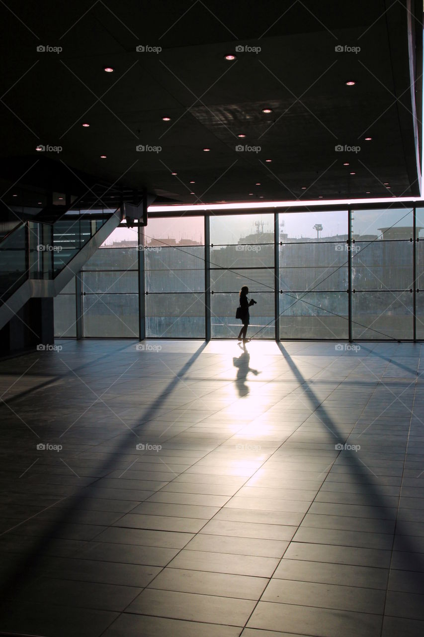silhouette in fronte of the window in the train station rome