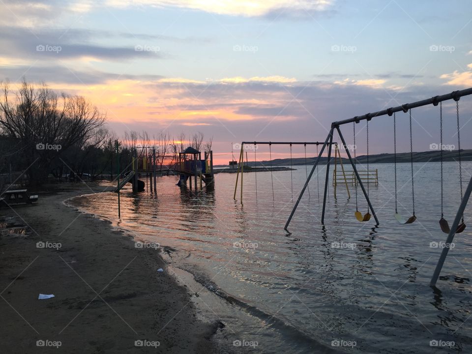 Sunset and flooded playground 