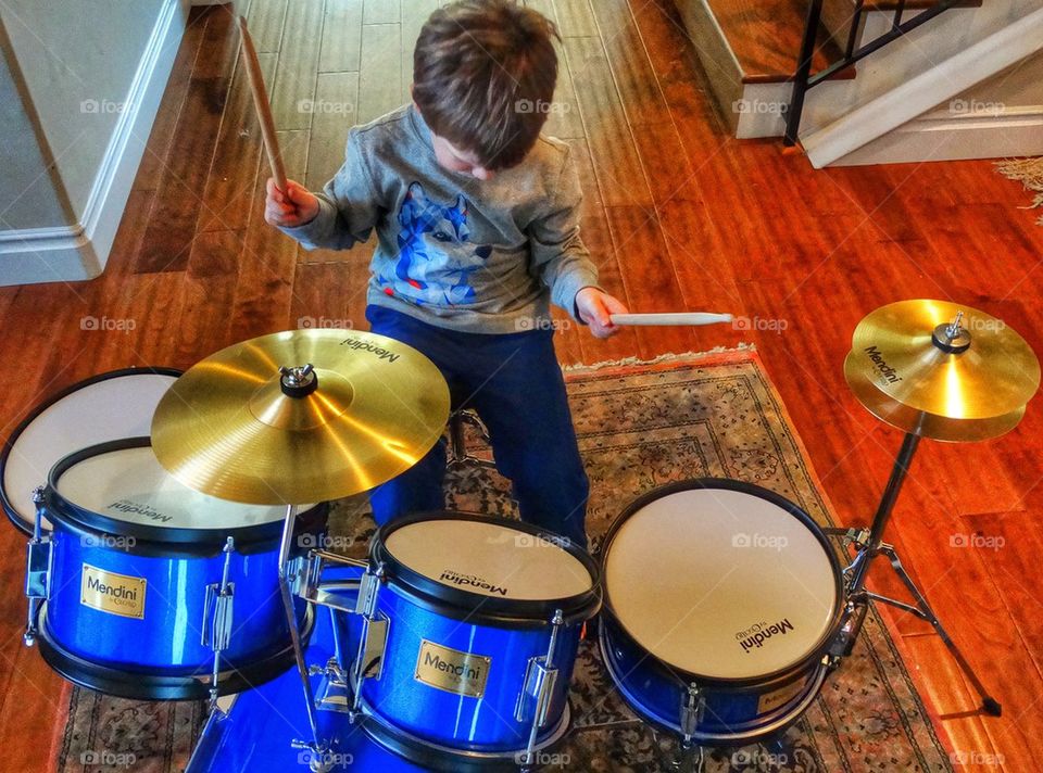 Boy Banging Drums. Young Boy Rocking Out On His Drum Set
