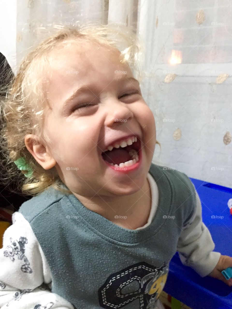 Close-up of little baby laughing