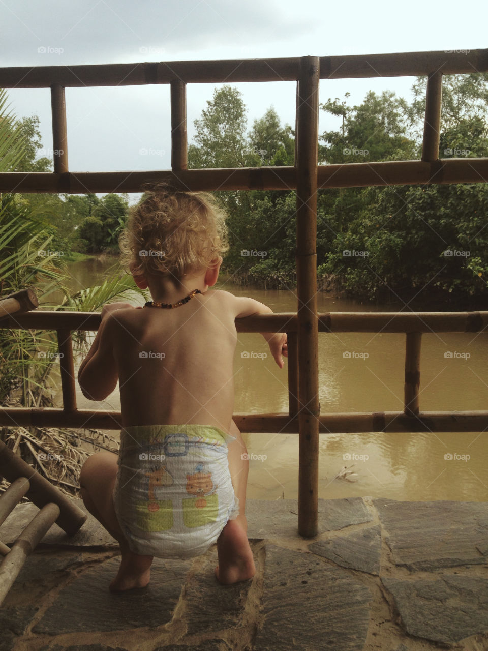 Boy in diapers along the Mekong Delta