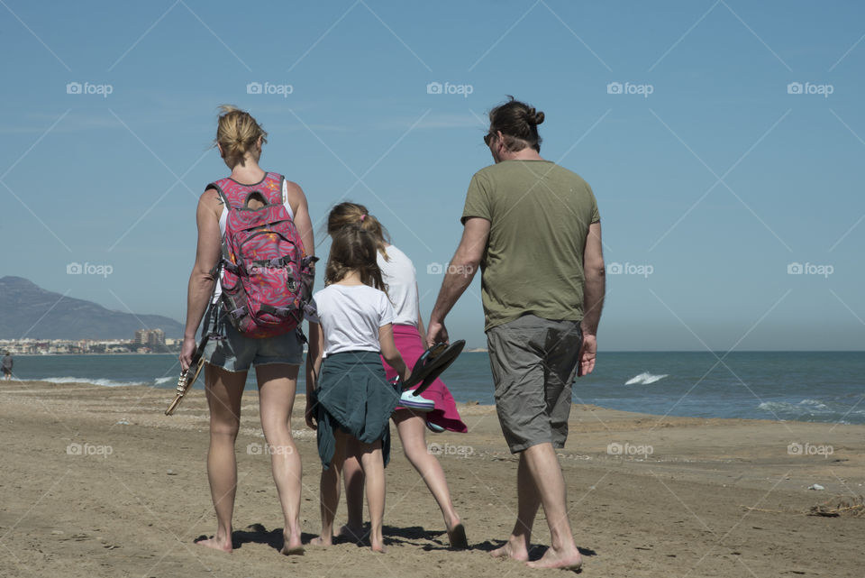  Family on the beach enjoying a happy day