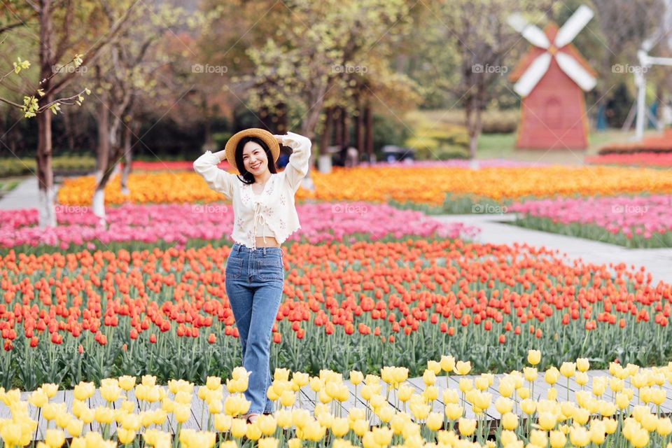 Beautiful asian woman and colorful tulips