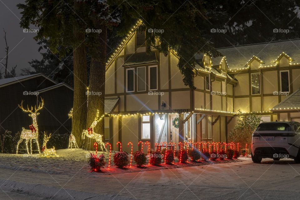 Big house decorated for Christmas with lights 