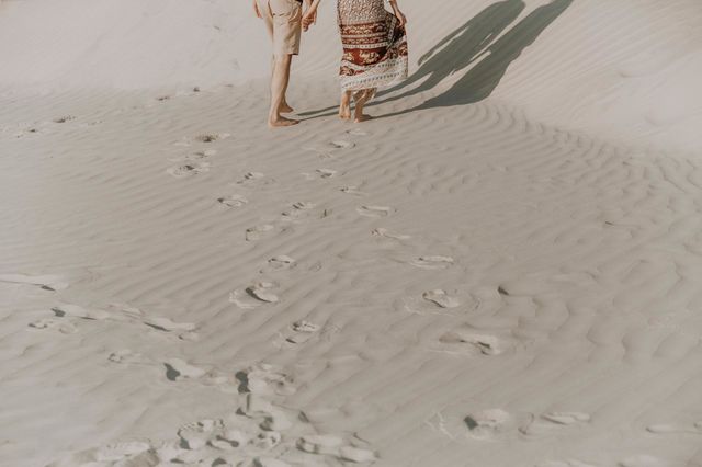 Couple in love walking in sand desert