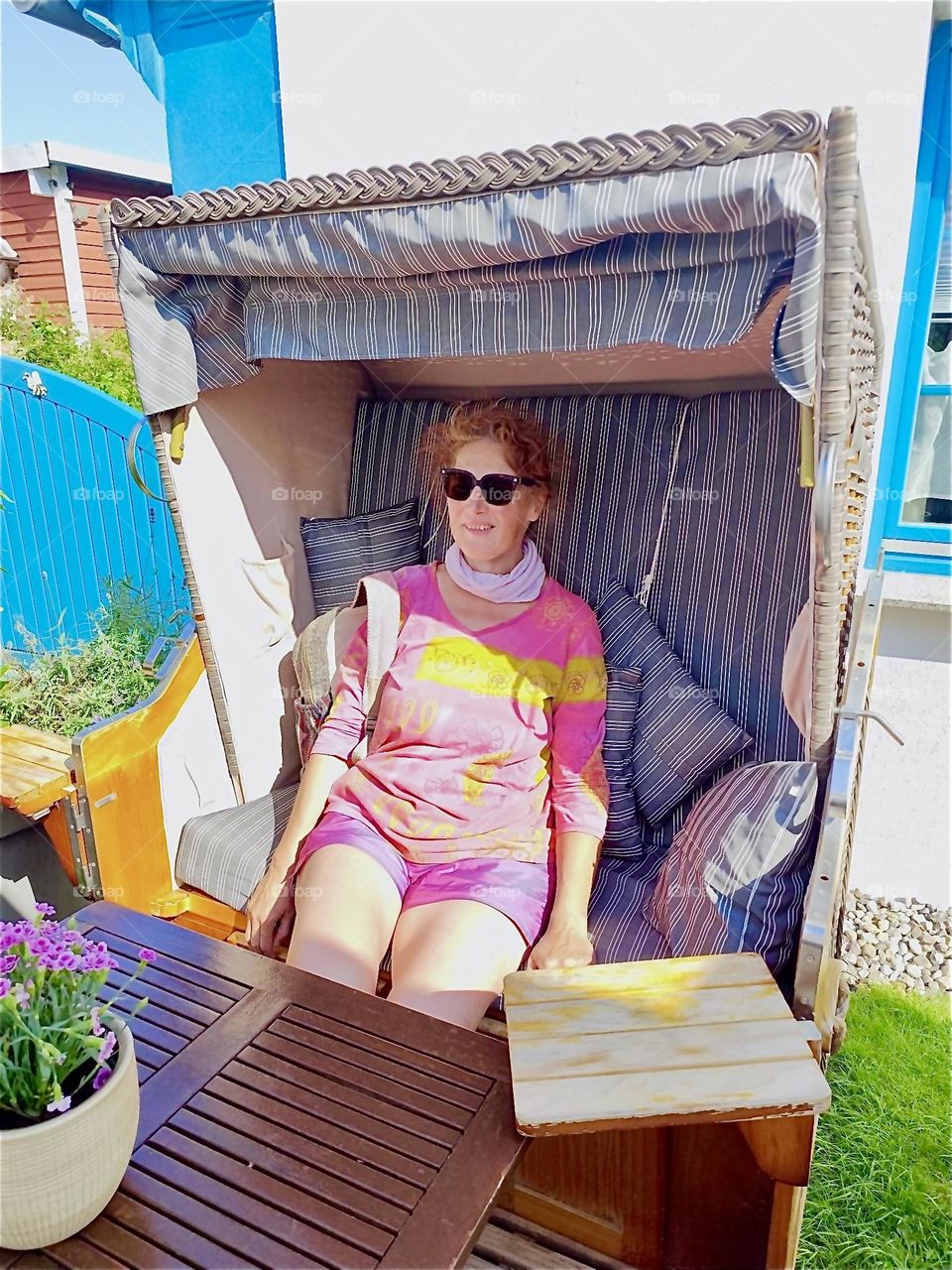 Enjoying a sunny summertime afternoon in the half shade of a comfortable beach basket is definitely the thing to do here in “Dranske” on the island “Rügen” in the “Baltic Sea” or “Ostsee” in “Western Pomerania”, Germany. 2024. Hypnotic Productions