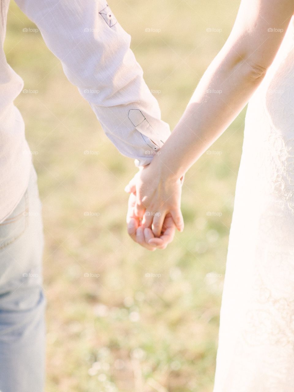 Couple holding hands outdoors