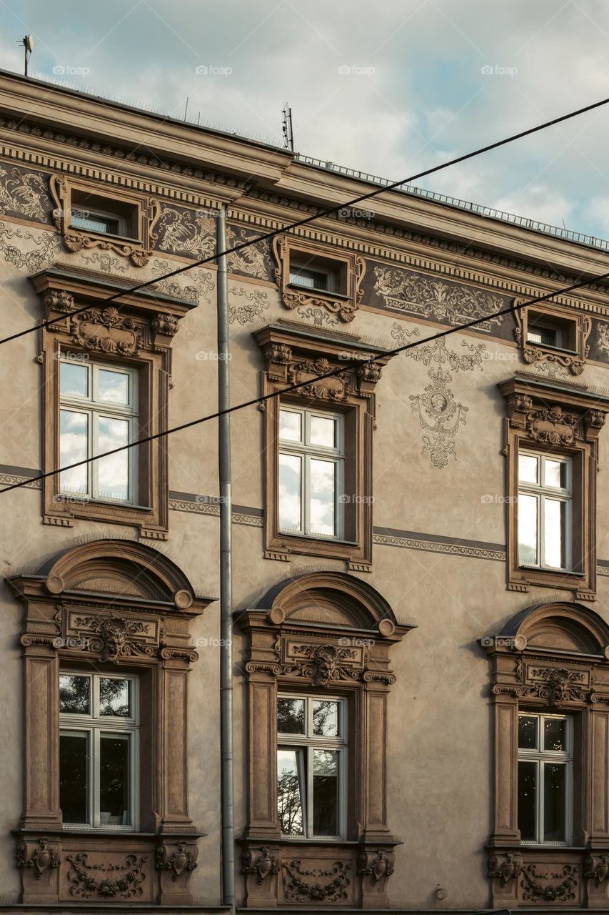 the facade of the tenement house beautifully decorated with ornaments