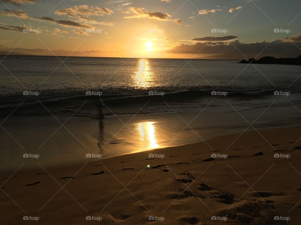 Silhouette of person at beach during sunset