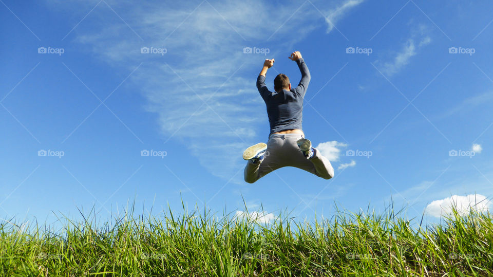 Jump in the Sky . A man jump in the blue sky