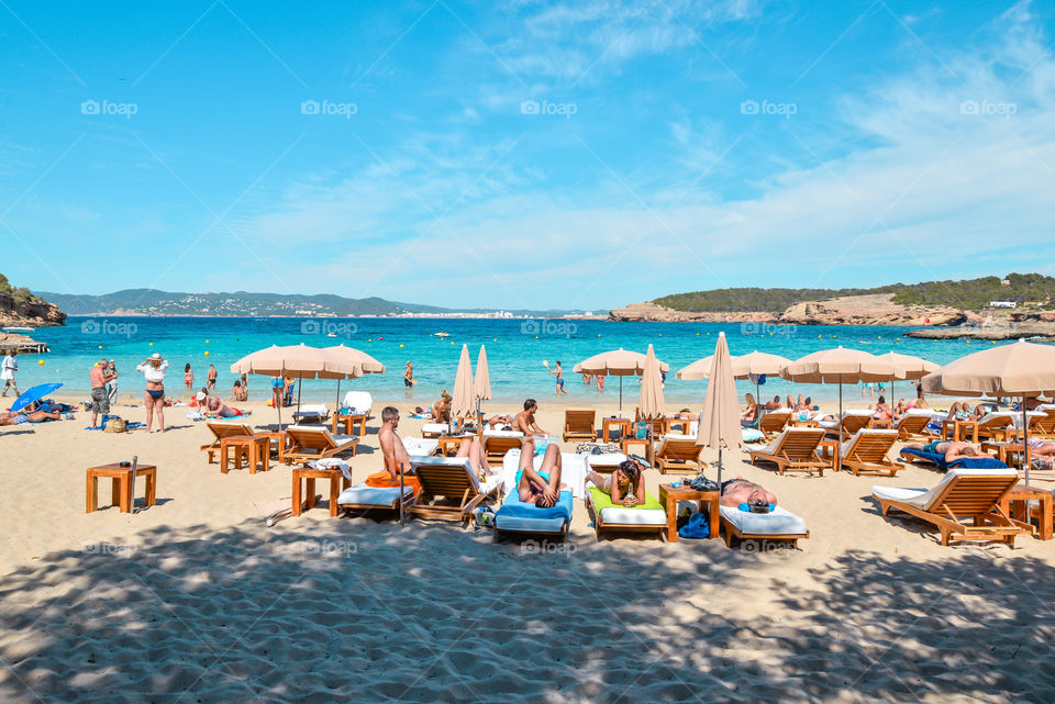 People sunbathing at cala bassa beach