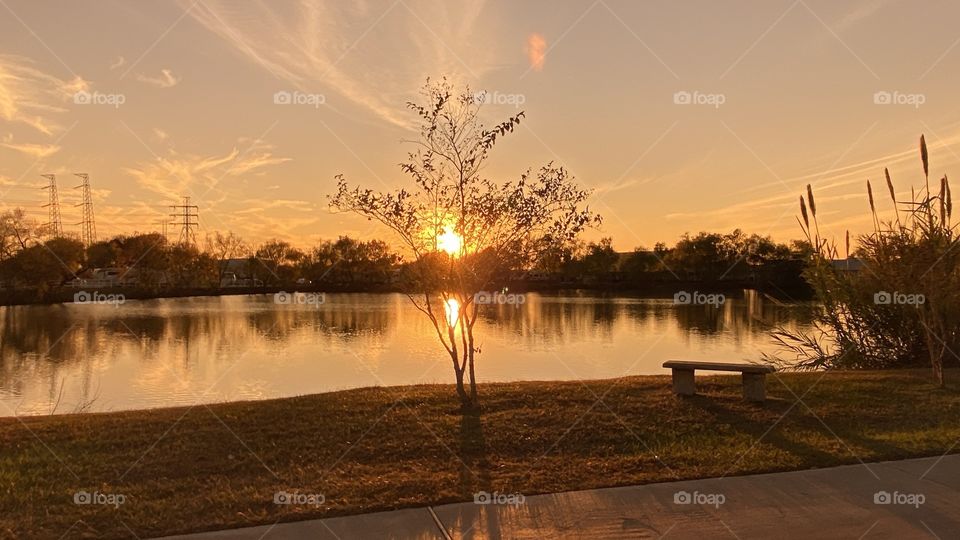 Stormy Weather has passed left cool weather high clouds blanket the sky reflections due to bright clouds for Sundown. 