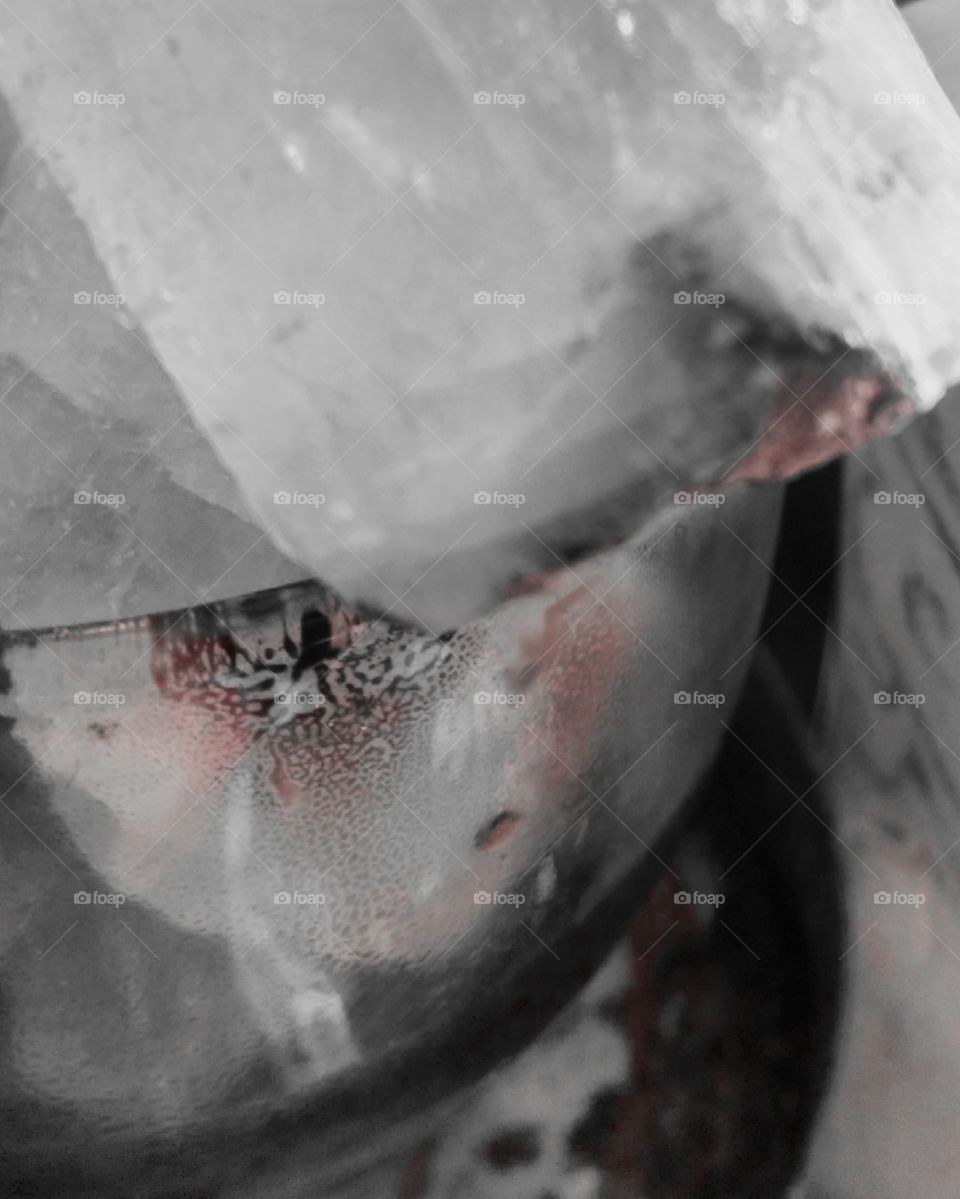 Crystal in a jar. The jar was something I used to muffle incent smoke and it has a nice little pattern. Next to it is a bone carving.